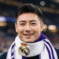 一位30多岁的男性球迷头像，戴着皇马围巾，面带微笑